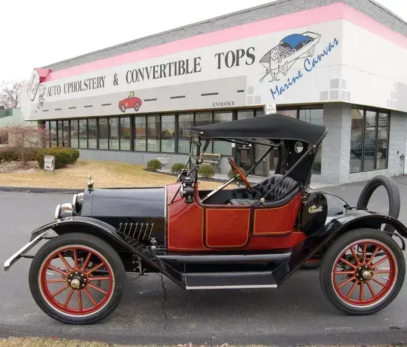 Restored 1915 Royal Mail with diamond-tufted leather seating and Stayfast canvas top.