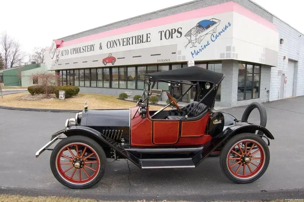 Restored 1915 Royal Mail with diamond-tufted leather seating and Stayfast canvas top.