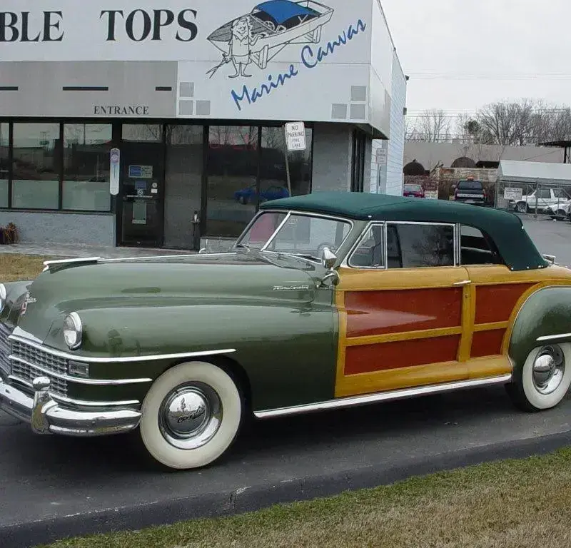 Side view of a fully restored 1948 Chrysler Town & Country.