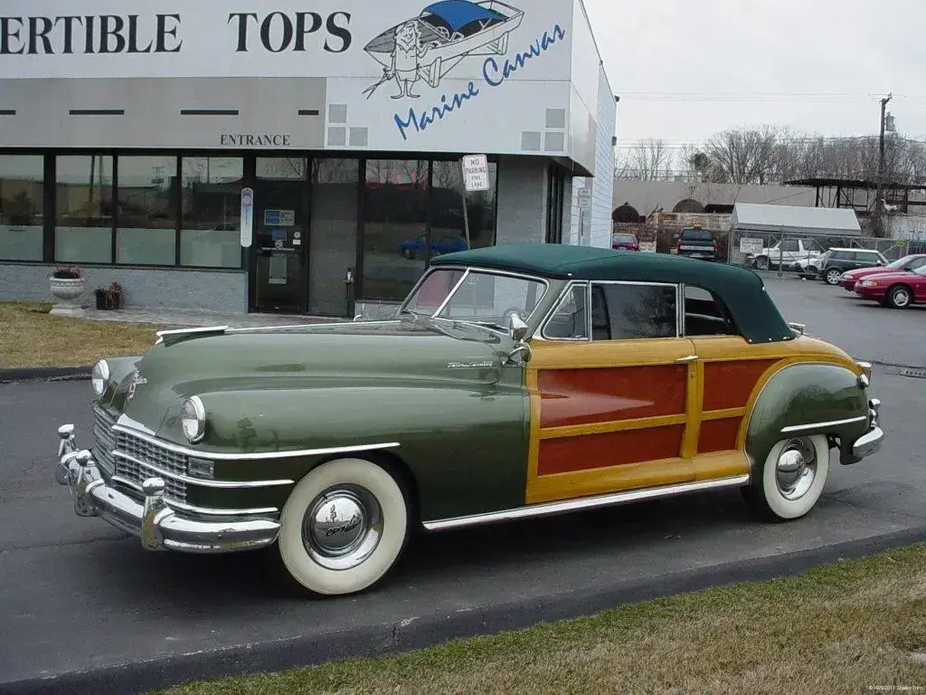 Side view of a fully restored 1948 Chrysler Town & Country.