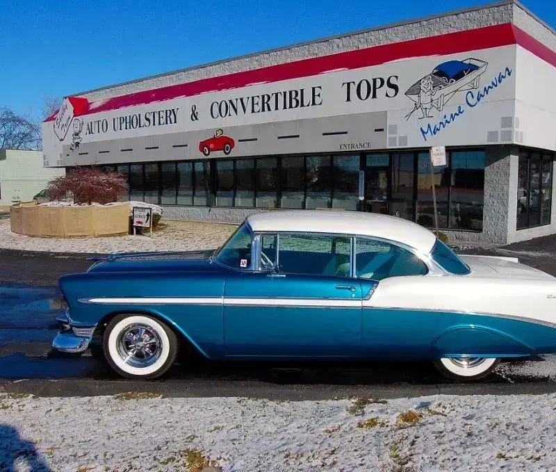 Side view of a fully restored 1956 Chevrolet Bel Air.