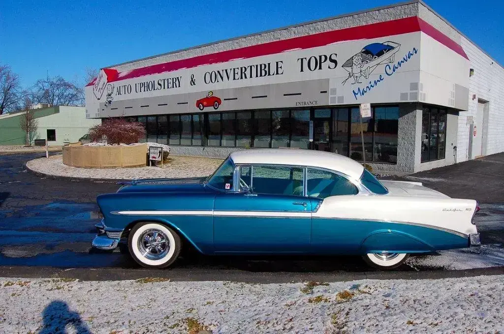Side view of a fully restored 1956 Chevrolet Bel Air.