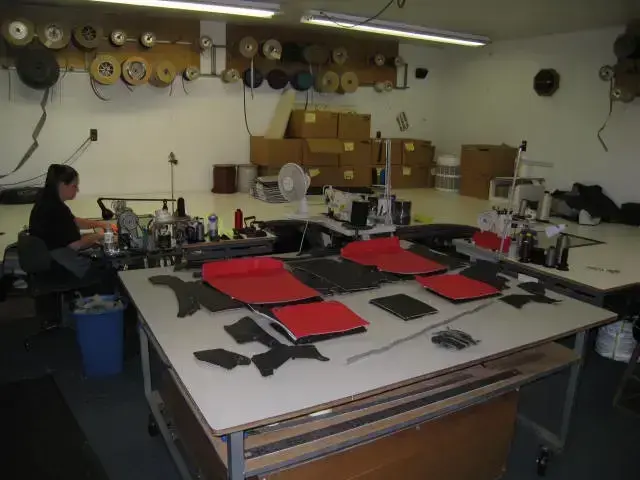 Workstations in the Shelby Trim sew room with multiple sewing machines.