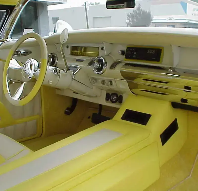 Detailed restored interior of a classic luxury automobile.