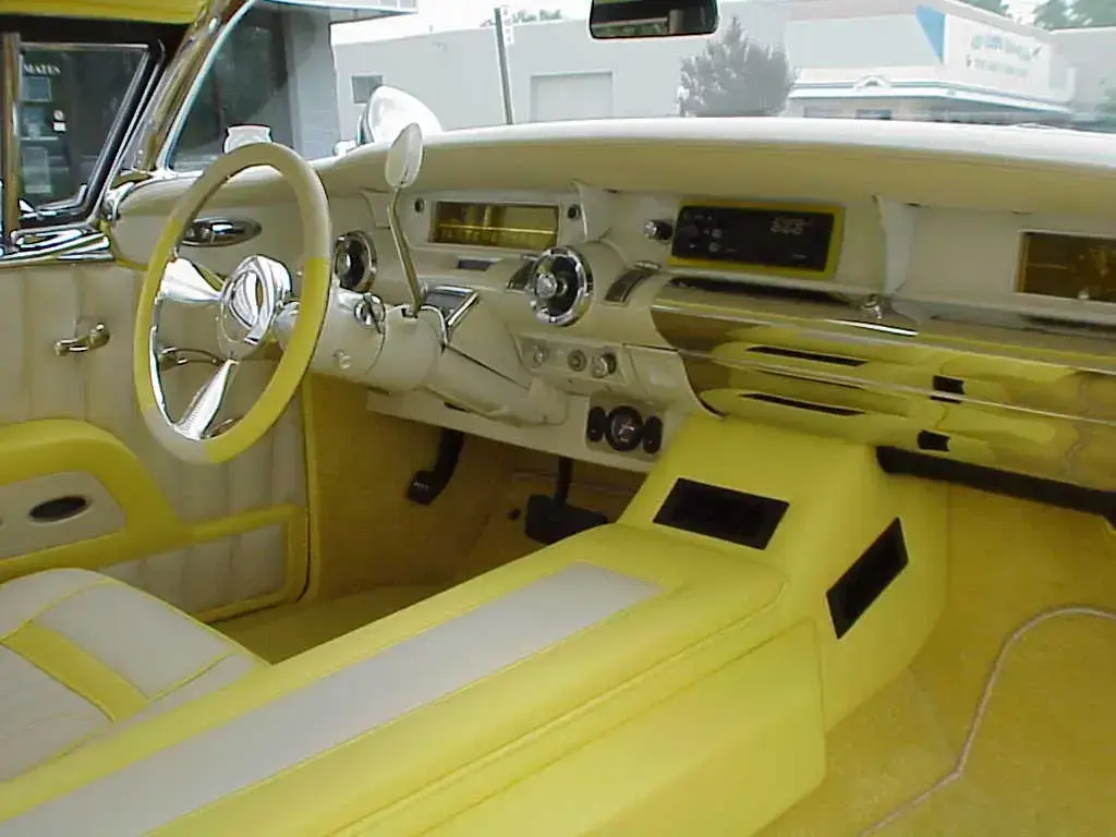 Detailed restored interior of a classic luxury automobile.