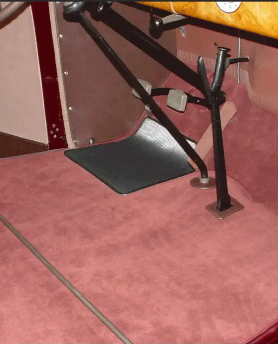 Red automotive carpet installation by Shelby Trim.