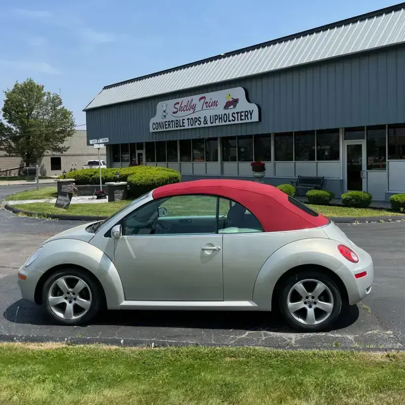 Volkswagen Beetle with a new red convertible top.