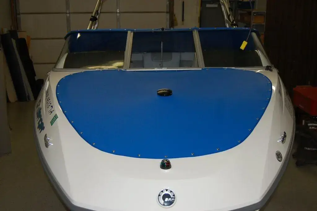 Blue marine canvas front cover on a trailerable boat.