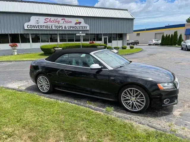 Black convertible top fitted on an Audi by Shelby Trim.