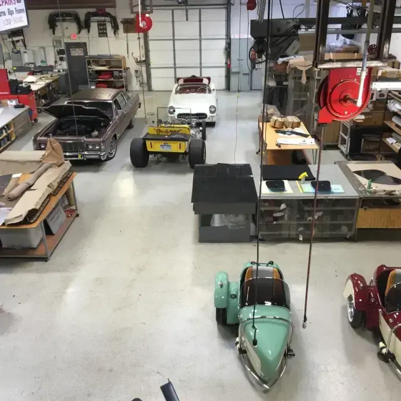 Shop floor at Shelby Trim with sidecars and ongoing projects.