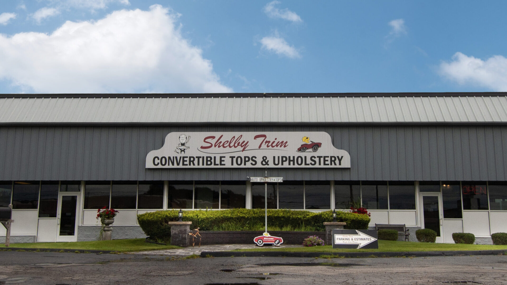 Exterior of the Shelby Trim Upholstery shop on Mound Road in Sterling Heights, Michigan.